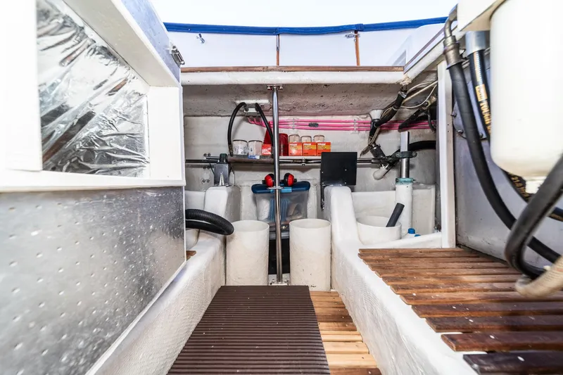 Slide: The Image of 1987 Fleming 50 Raised Pilothouse engine room with equipment and storage. - 39