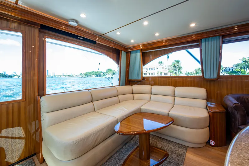Slide: The Image of Luxurious interior of 2016 Viking 46 Convertible yacht with plush seating and scenic windows. - 15