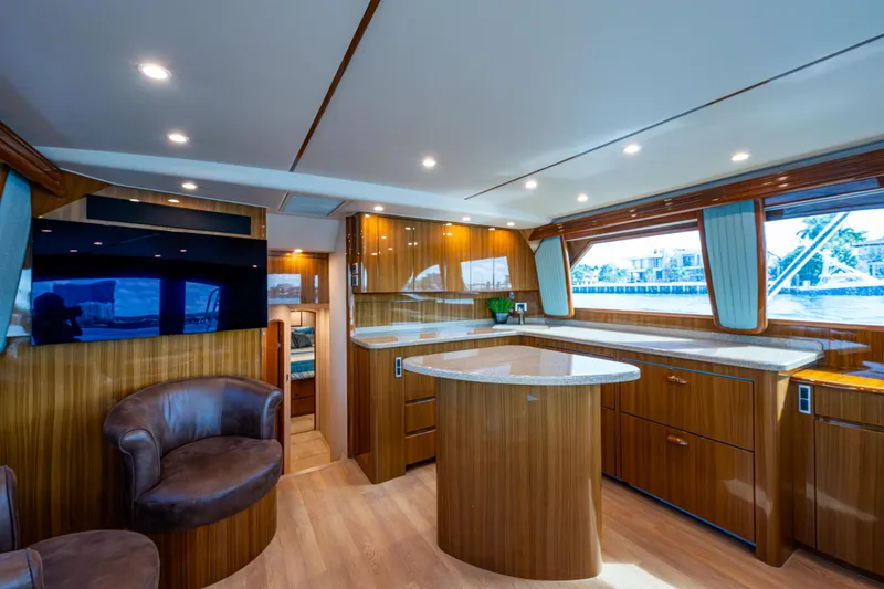 Slide: The Image of Luxurious interior of 2016 Viking 46 Convertible yacht with modern furnishings and wood finishes. - 18