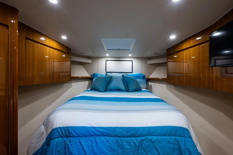 Slide: The Image of Luxurious cabin interior of 2016 Viking 46 Convertible yacht with cozy bedding. - 23