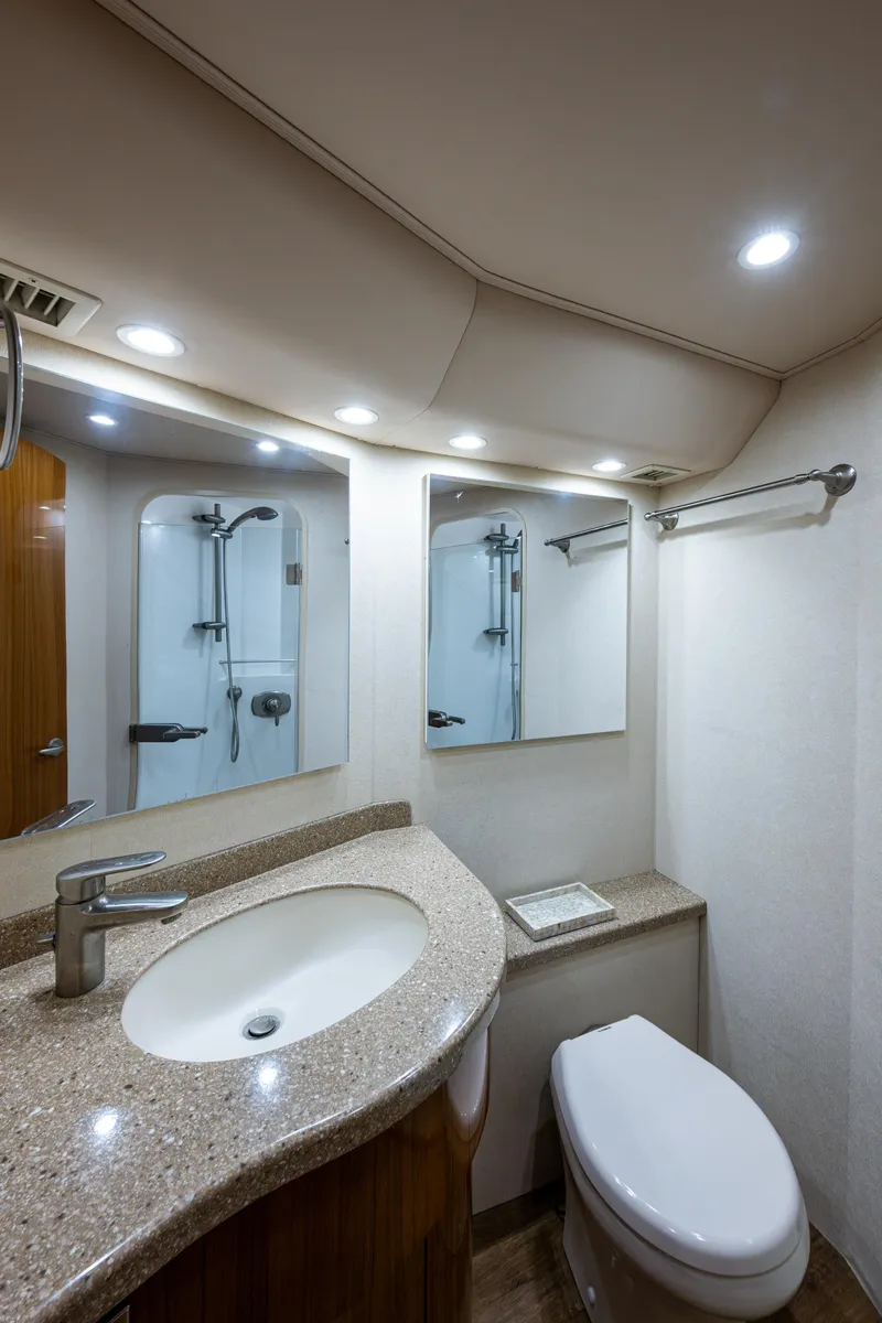 Slide: The Image of Luxurious bathroom in 2016 Viking 46 Convertible yacht with modern fixtures and elegant design. - 27