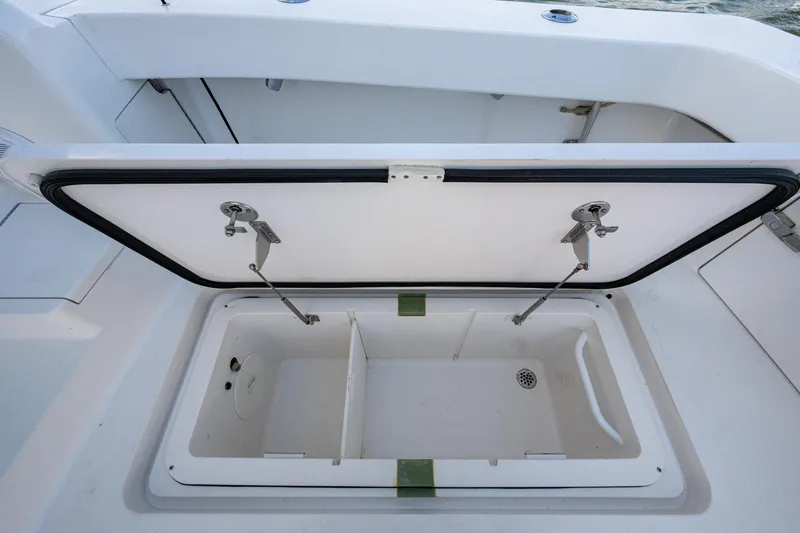 Slide: The Image of Open storage compartment on a 2016 Viking 46 Convertible boat. - 43