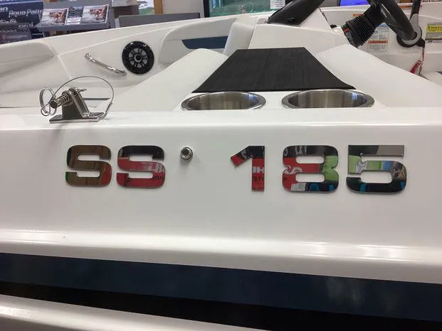 Slide: The Image of 2024 Hurricane SS-185 OB boat interior with cup holders and steering wheel. - 10