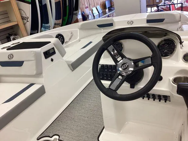 Slide: The Image of 2024 Hurricane SS-185 OB boat interior with steering wheel and dashboard controls. - 7