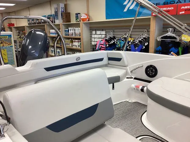 Slide: The Image of 2024 Hurricane SS-185 OB boat interior with seating and accessories in a showroom. - 8