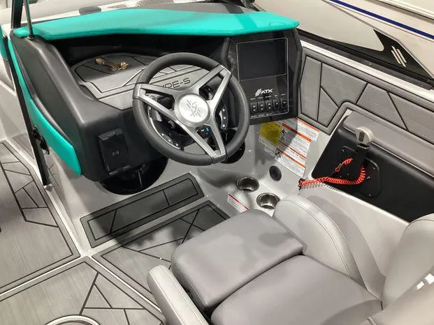 Slide: The Image of 2024 ATX Surf Boats 22ATX interior with modern dashboard and steering wheel design. - 15