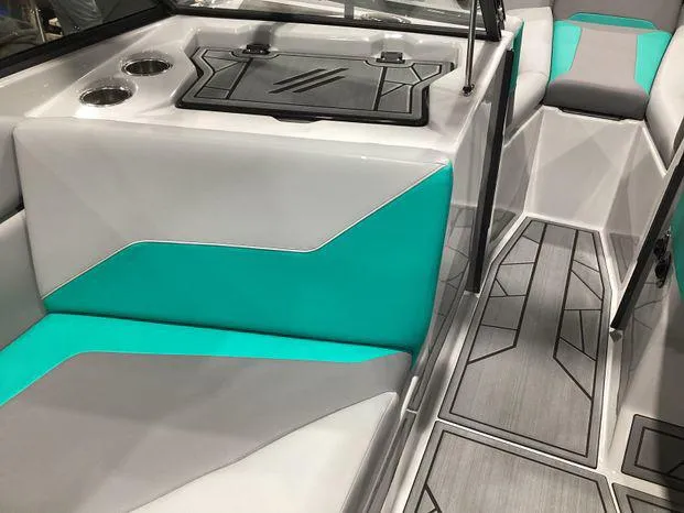Slide: The Image of 2024 ATX Surf Boats 22ATX interior with teal and gray seating, modern design. - 17