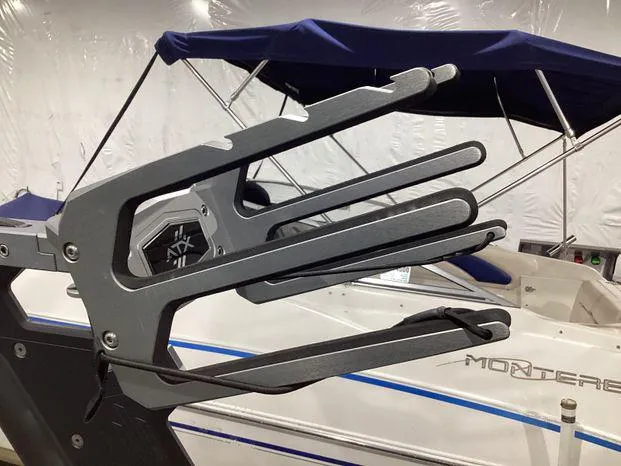 Slide: The Image of 2024 ATX Surf Boats 22ATX wakeboard rack, sleek design, mounted on boat. - 20