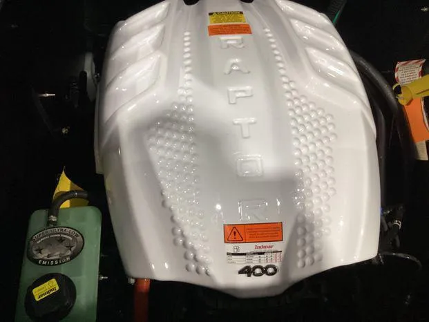 Slide: The Image of 2024 ATX Surf Boats 22ATX engine, featuring a Raptor 400 cover. - 24