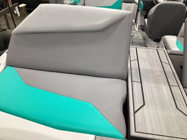 Slide: The Image of 2024 ATX Surf Boats 22ATX interior with gray and teal seating and sleek design. - 4