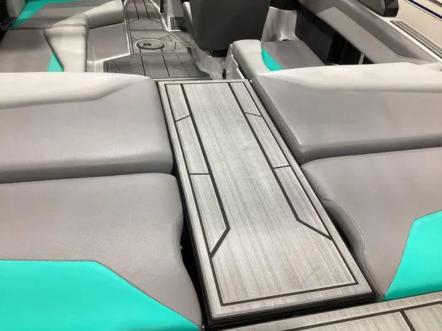 Slide: The Image of 2024 ATX Surf Boats 22ATX interior with gray and teal seating and sleek design. - 8