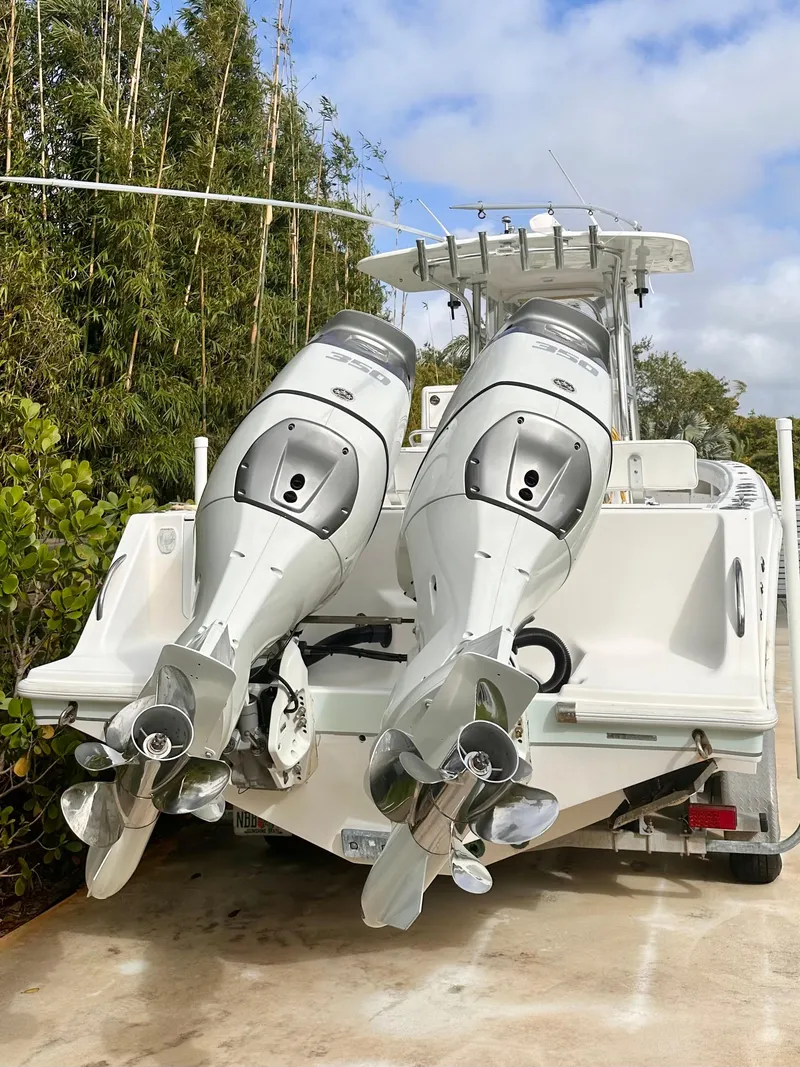 Slide: The Image of 2007 SeaVee 320B boat with dual outboard engines, parked on a concrete surface. - 3