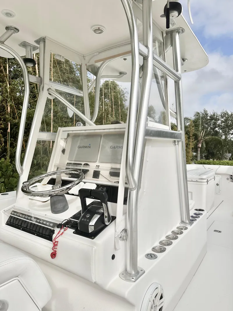 Slide: The Image of 2007 SeaVee 320B boat console with steering wheel and navigation equipment. - 5