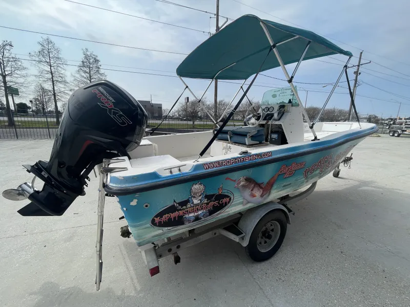 Slide: The Image of 1999 Bayliner 17cc boat with Mercury Pro XS engine and custom graphics on trailer. - 7