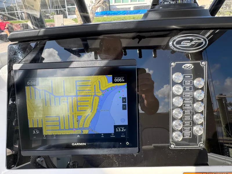 Slide: The Image of 2023 Sea Fox 268 Commander dashboard with Garmin navigation display. - 13