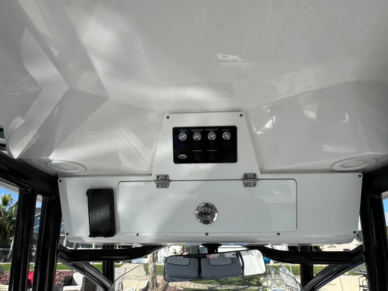 Slide: The Image of 2023 Sea Fox 268 Commander boat console with control panel and storage compartment. - 15