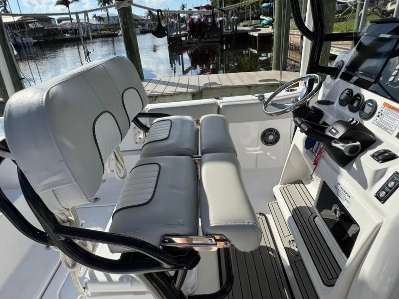 Slide: The Image of 2023 Sea Fox 268 Commander boat interior with dual seats and steering console. - 18