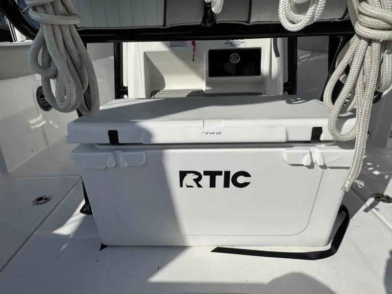 Slide: The Image of RTIC cooler on 2023 Sea Fox 268 Commander boat deck with coiled ropes. - 20