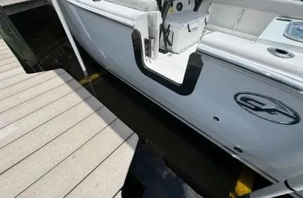 Slide: The Image of 2023 Sea Fox 268 Commander boat docked beside a wooden pier. - 25
