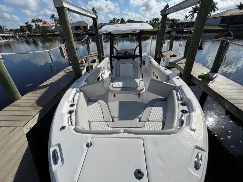 Slide: The Image of 2023 Sea Fox 268 Commander boat docked, showcasing spacious seating and sleek design. - 26