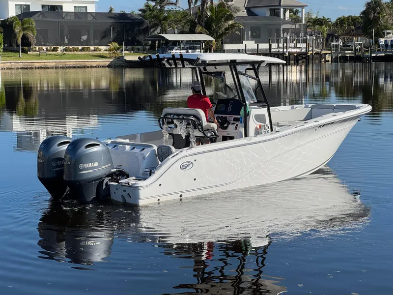 Slide: The Image of 2023 Sea Fox 268 Commander boat on calm water with dual Yamaha engines. - 3