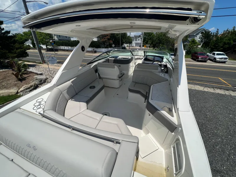 Slide: The Image of 2022 Sea Ray SLX 310 boat interior with spacious seating and modern design. - 10