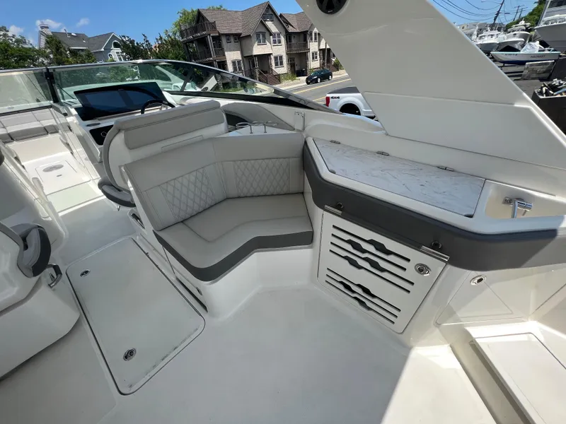 Slide: The Image of Luxurious interior of 2022 Sea Ray SLX 310 boat with elegant seating and modern design. - 12