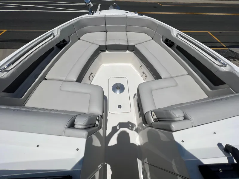 Slide: The Image of 2022 Sea Ray SLX 310 boat interior with spacious seating and modern design. - 24