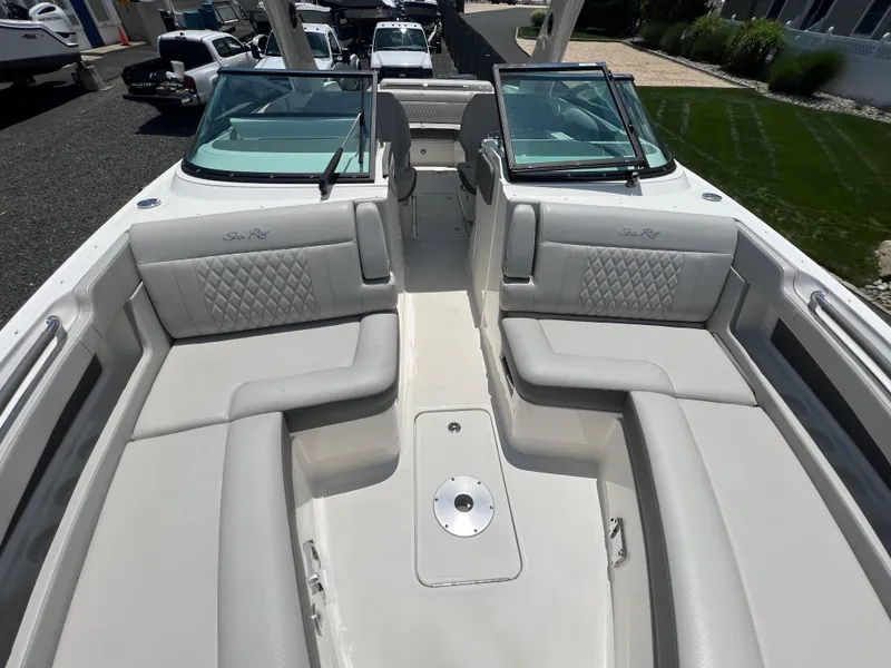 Slide: The Image of 2022 Sea Ray SLX 310 boat interior with luxurious seating and open deck. - 28