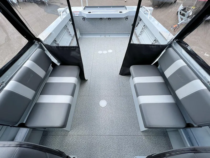 Slide: The Image of Interior of 2023 Hewescraft 200 PRO V ET boat with gray seating and flooring. - 12