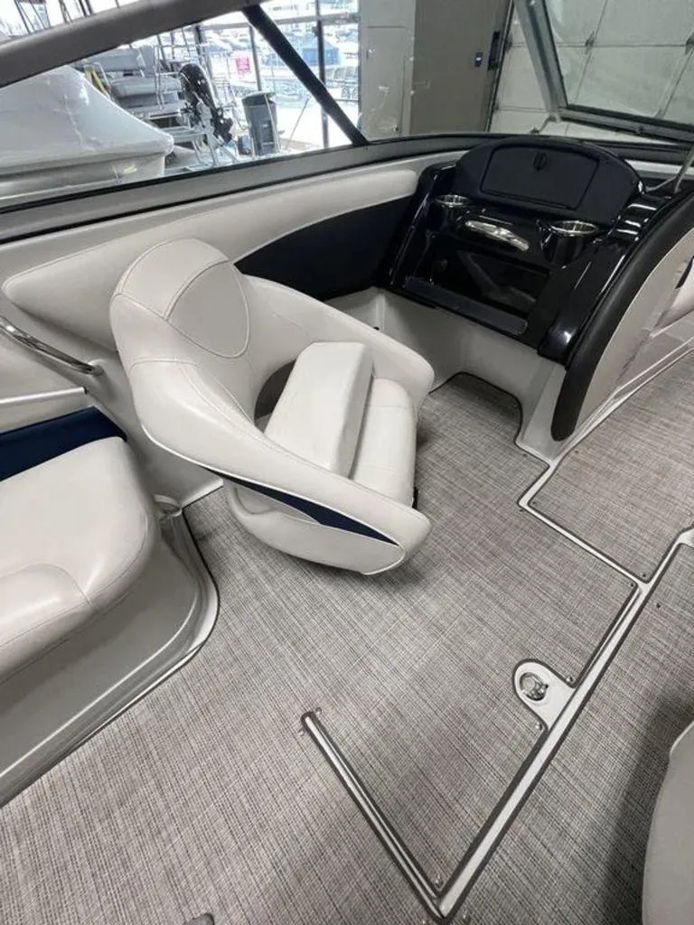 Slide: The Image of Interior of a 2020 Crownline 205 SS boat, featuring sleek seating and modern design. - 11