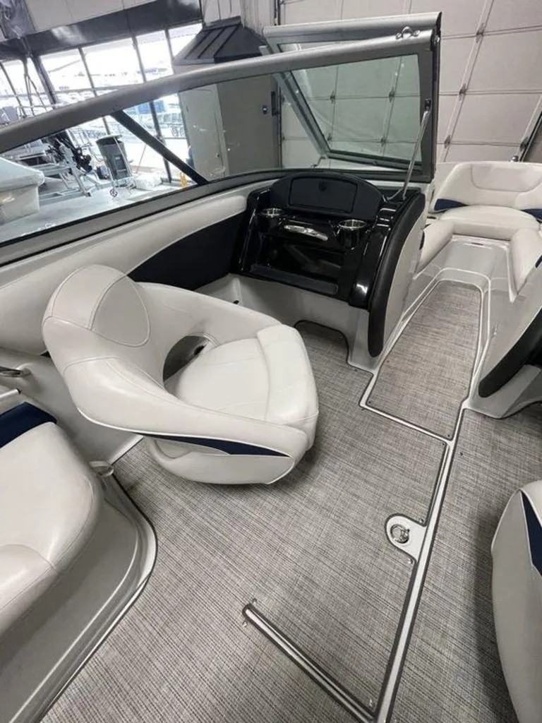 Slide: The Image of 2020 Crownline 205 SS boat interior with modern seating and sleek design. - 12