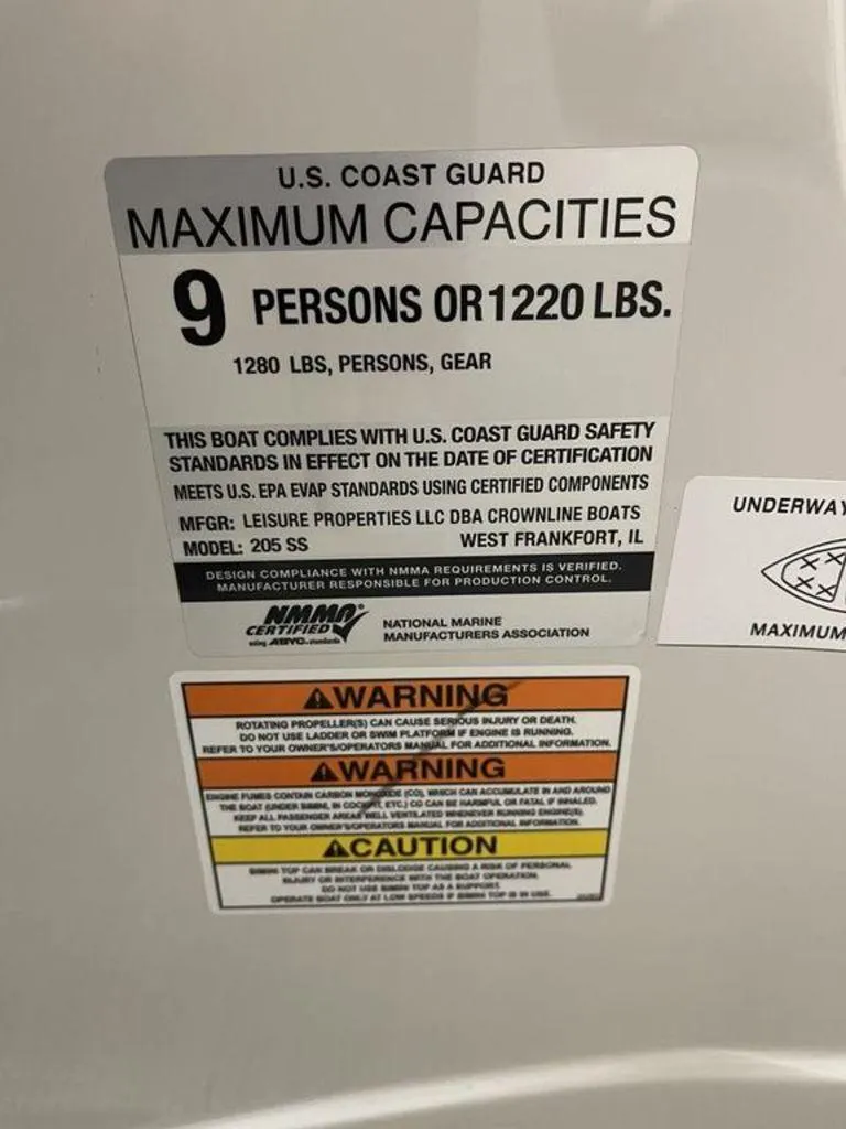 Slide: The Image of Capacity label for 2020 Crownline 205 SS boat, maximum 9 persons or 1220 lbs. - 14