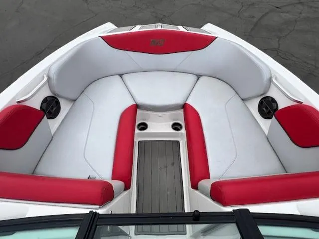 Slide: The Image of 2018 MasterCraft NXT22 boat interior with red and white seating. - 16
