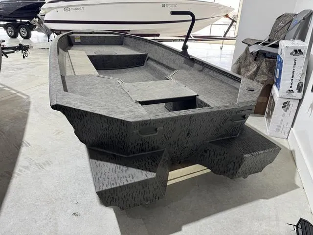 Slide: The Image of 2025 War Eagle MODEL 750 - GLADIATOR boat in showroom, featuring a rugged design. - 7