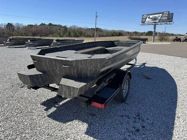 Slide: The Image of 2025 War Eagle MODEL 750 - GLADIATOR boat on trailer, parked on gravel lot. - 3
