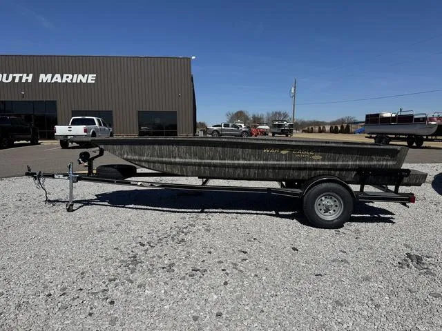 Slide: The Image of 2025 War Eagle MODEL 750 - GLADIATOR boat on trailer outside dealership. - 4