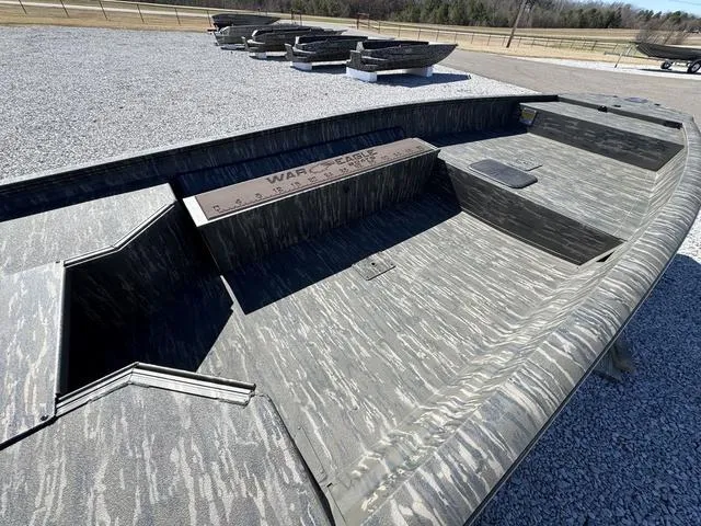 Slide: The Image of War Eagle MODEL 750 - GLADIATOR 2025 boat with camouflage design on gravel lot. - 8