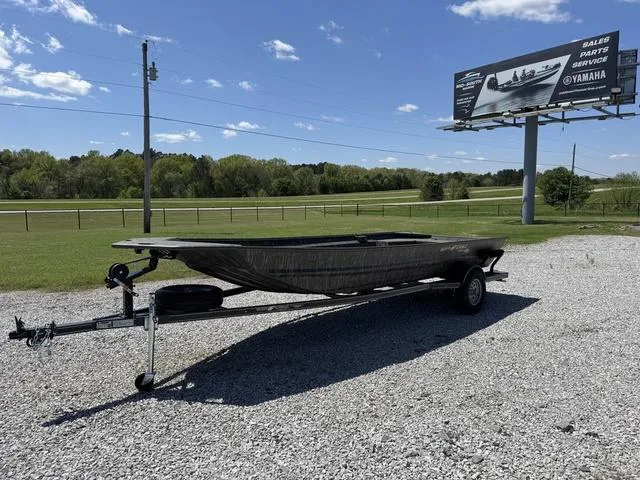 Slide: The Image of Man operating War Eagle 754 LDV 21" boat on a calm river, 2025 model. - 1