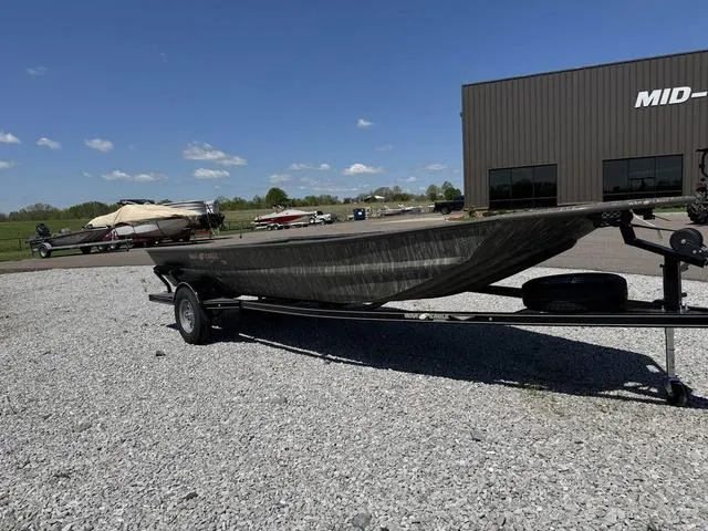 Slide: The Image of Four people in a 2025 War Eagle 754 LDV boat on a wooded lake. - 3