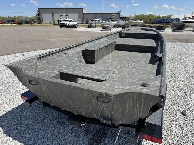 Slide: The Image of 2025 War Eagle 754 LDV boat on gravel lot, showcasing rugged design and spacious interior. - 5