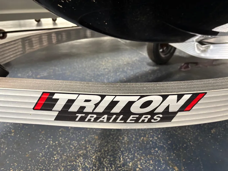 Slide: The Image of Triton Trailers logo on a trailer for a 2023 Kawasaki ULTRA 160LX. - 12
