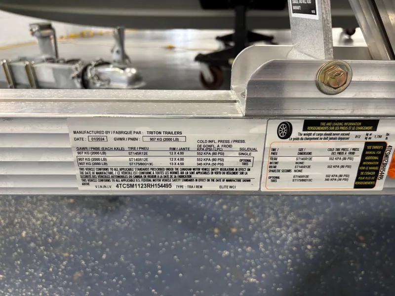 Slide: The Image of Label on a 2023 Kawasaki ULTRA 160LX trailer, displaying specifications and manufacturing details. - 13