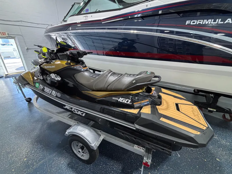 Slide: The Image of Dashboard of a 2023 Kawasaki ULTRA 160LX showing speedometer and various indicators. - 2