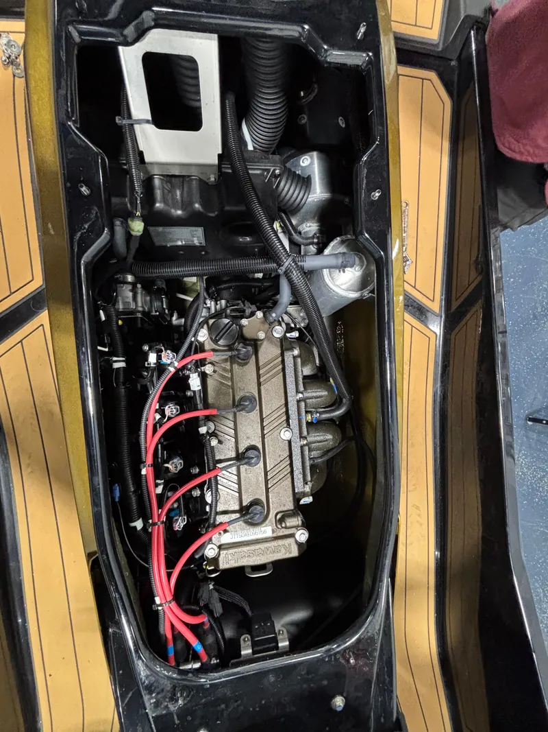 Slide: The Image of 2023 Kawasaki ULTRA 160LX engine compartment with visible components and wiring. - 7