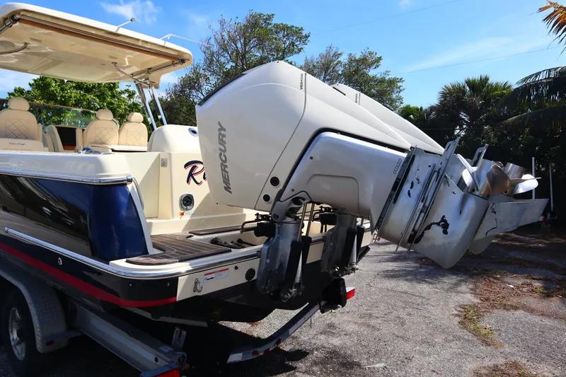 Slide: The Image of 2020 Chris-Craft Calypso 30 boat with Mercury outboard engines on a trailer. - 12