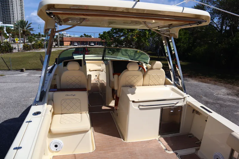 Slide: The Image of 2020 Chris-Craft Calypso 30 boat interior with beige seating and modern amenities. - 13