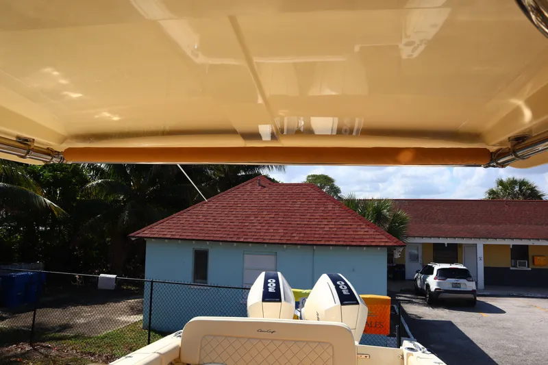 Slide: The Image of 2020 Chris-Craft Calypso 30 boat with dual engines, viewed from under canopy. - 29