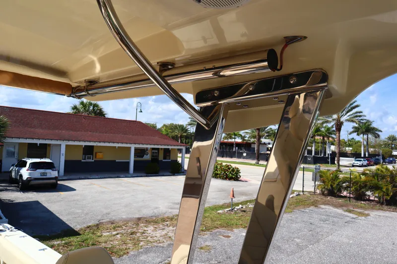 Slide: The Image of 2020 Chris-Craft Calypso 30 boat detail with chrome fixtures and outdoor background. - 30