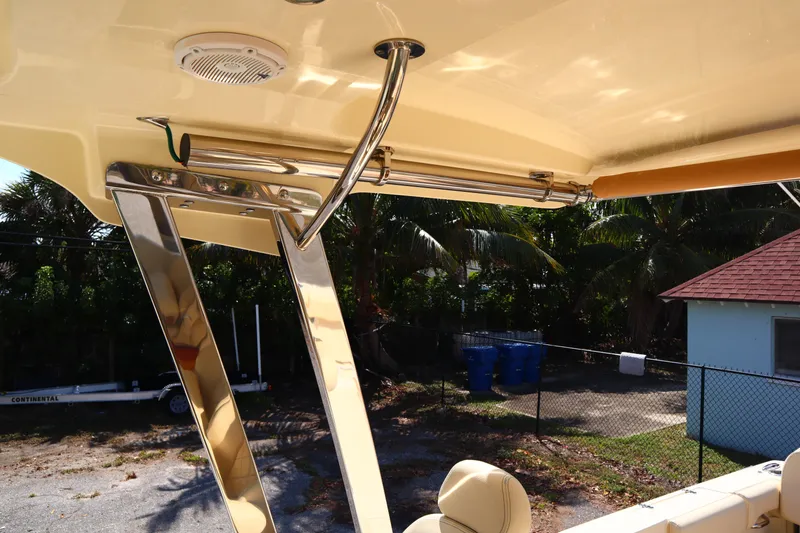 Slide: The Image of 2020 Chris-Craft Calypso 30 boat interior with polished metal accents and seating. - 31